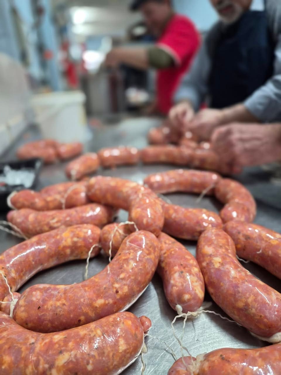 Freshly made salami on a workbench